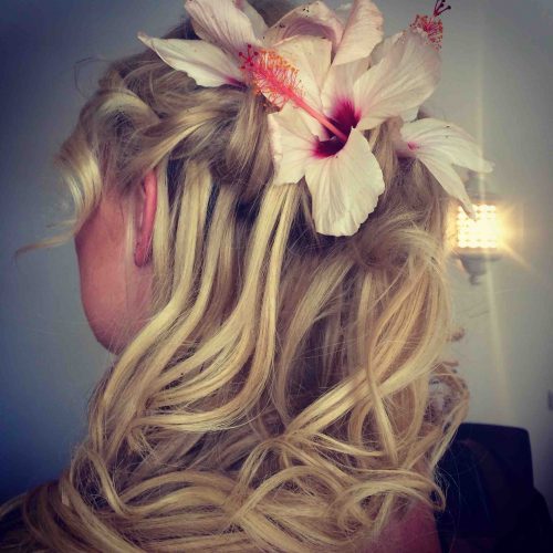 Flowing hair style with flower Algarve Wedding